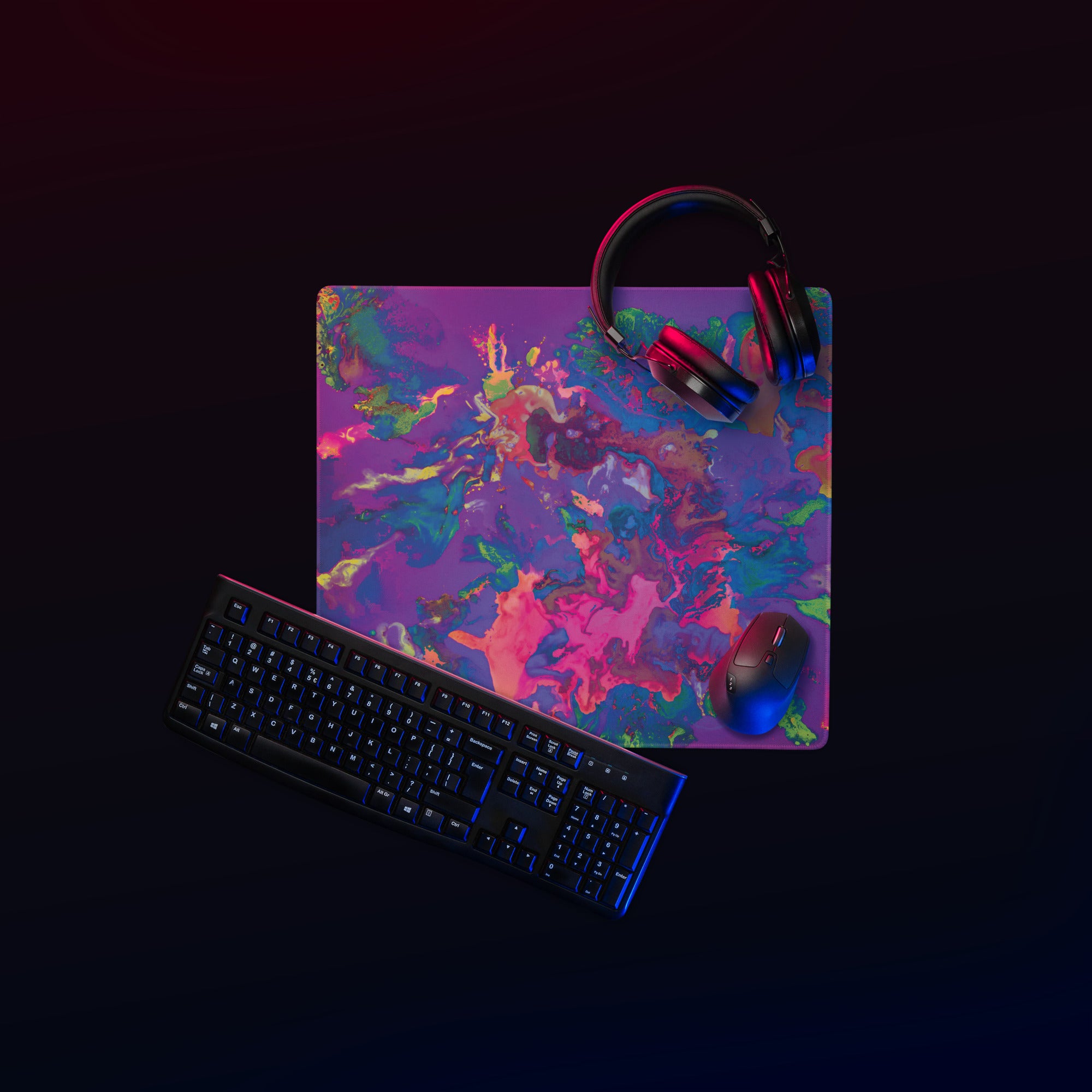 Colorful mouse pad with keyboard, mouse, and headphones on a black background