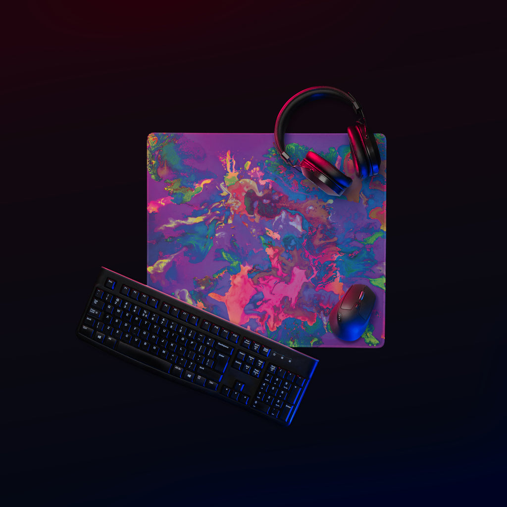 Colorful mouse pad with keyboard, mouse, and headphones on a black background