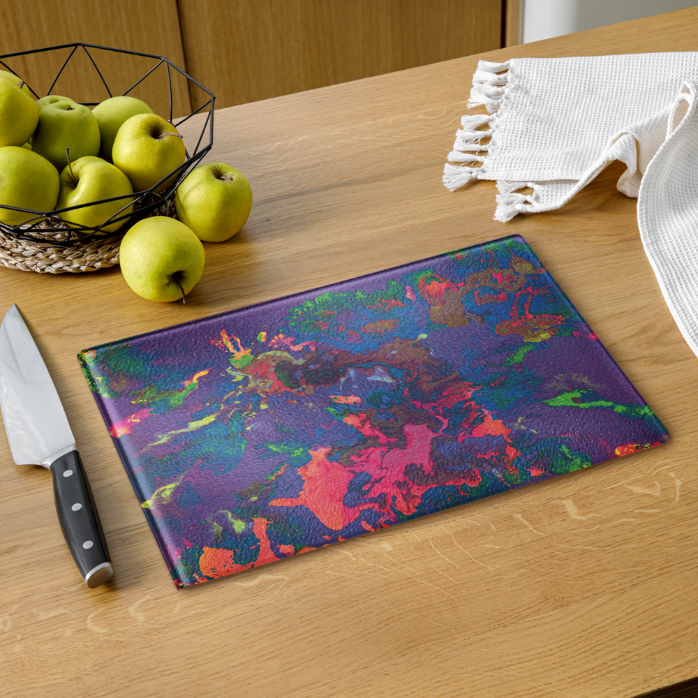 Pastel glass cutting board with apples and a cloth on the side