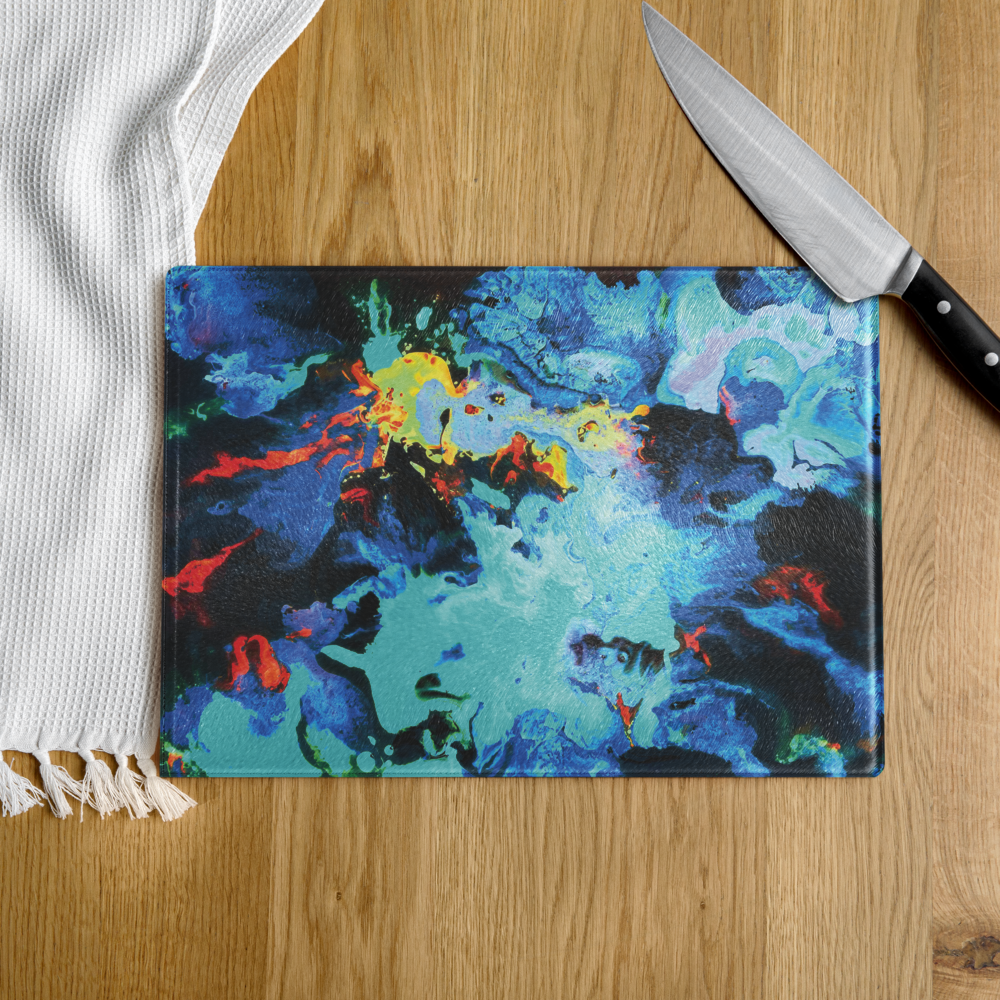 Colorful blue abstract art cutting board on a wooden surface with a knife.
