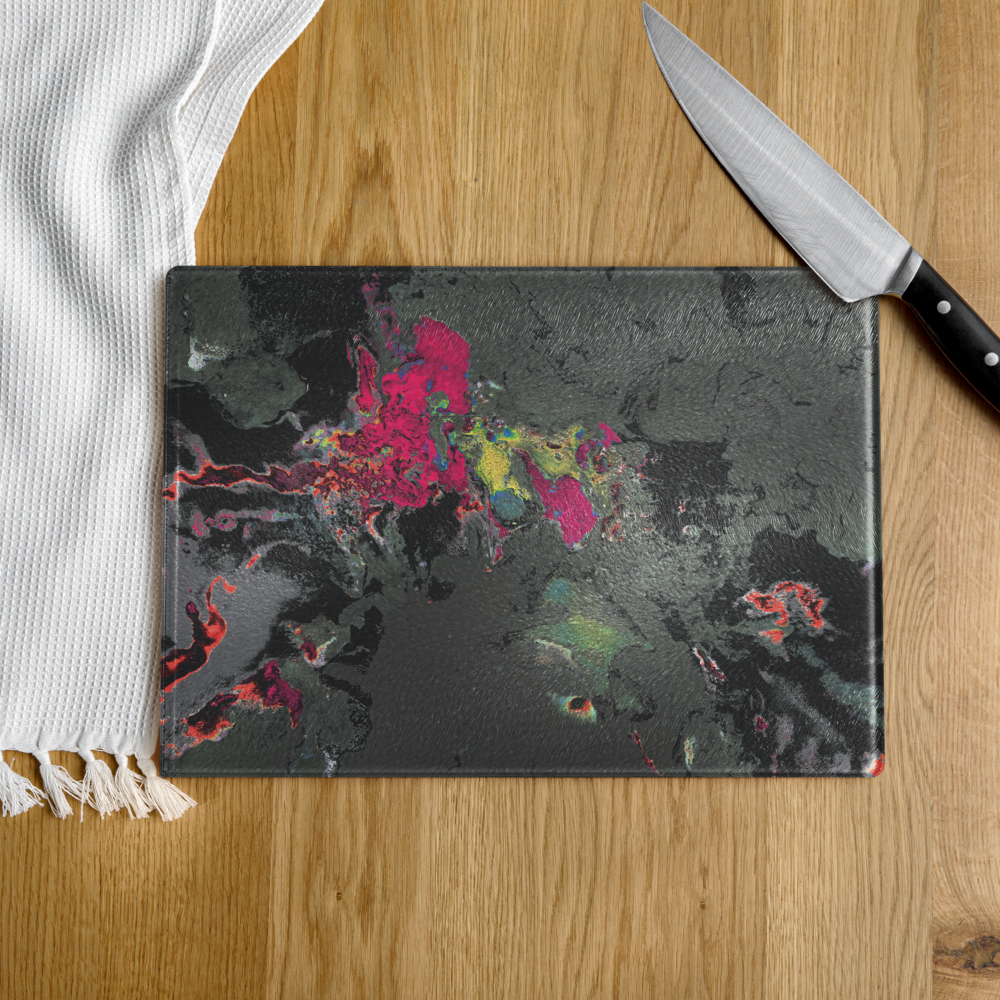 Colorful abstract design on a cutting board with a knife on a wooden surface